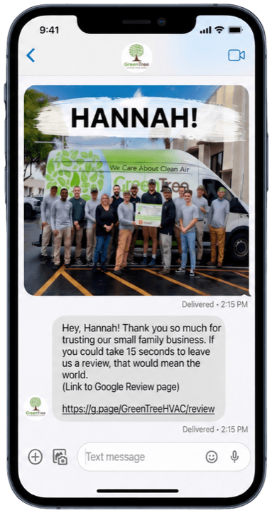 A phone showing an example review request text message from GreenTree to a customer named Hannah